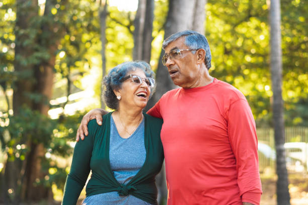 istock Senior couple walking in the public park 1162152101