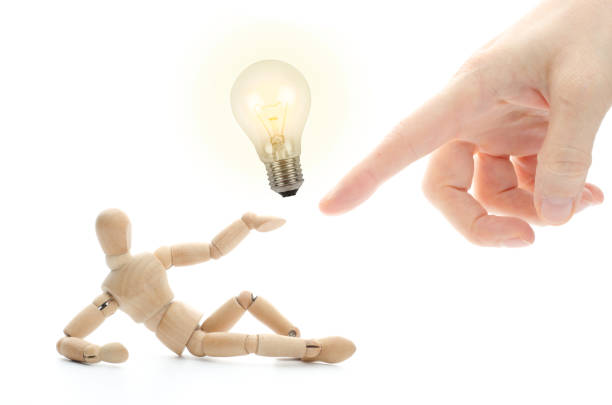 Wooden mannequin and his new idea - concept for innovation
