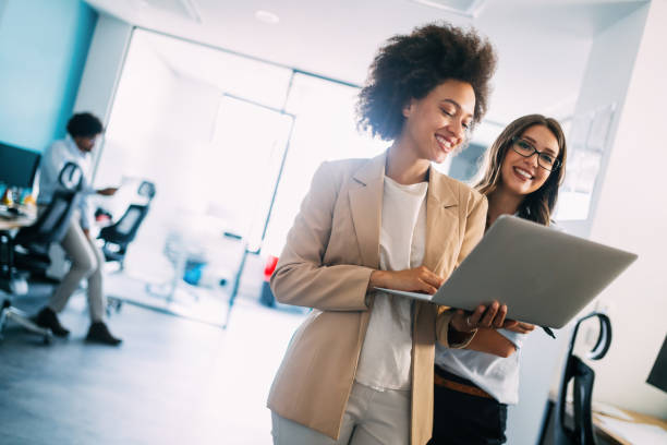 istock Successful business group of people at work in office 1162152376