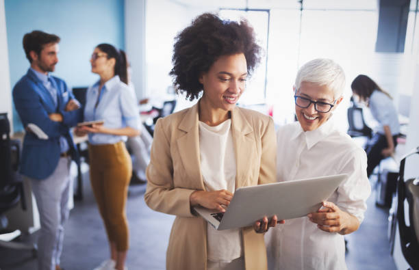 istock Group of successful business people at work in office 1162152395