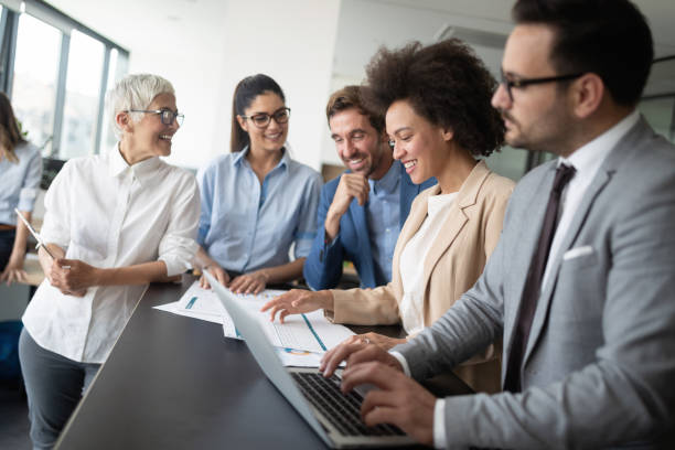 istock Successful business group of people at work in office 1162153471