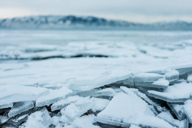 Shards of cracked ice on shore of frozen lake Cracked shards of ice on shore of frozen Utah Lake, USA lake utah stock pictures, royalty-free photos & images