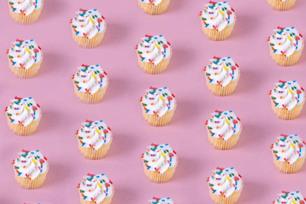 istock Cupcakes on pastel blush color 1162155060
