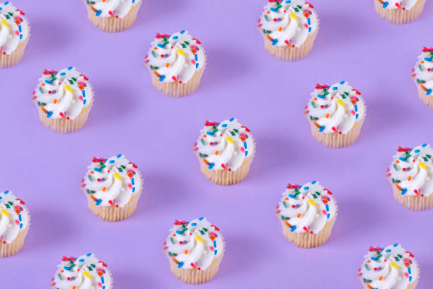 istock Cupcakes on purple color 1162155102