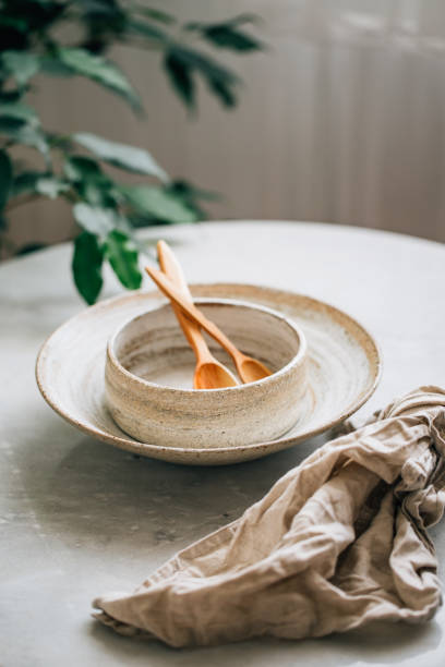 istock hand made Stack of Plates, Bowls and cup in rustic style 1162156301