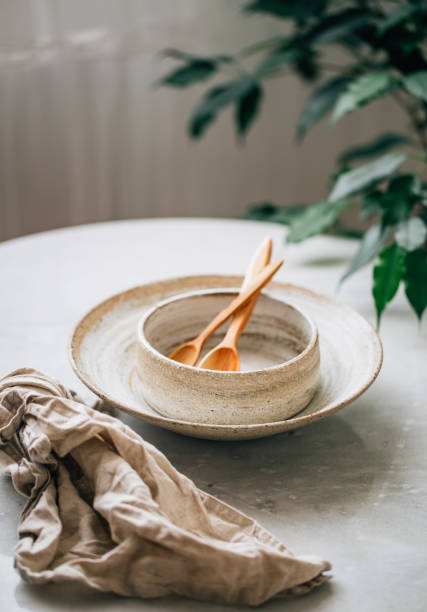 istock hand made Stack of Plates, Bowls and cup in rustic style 1162156311