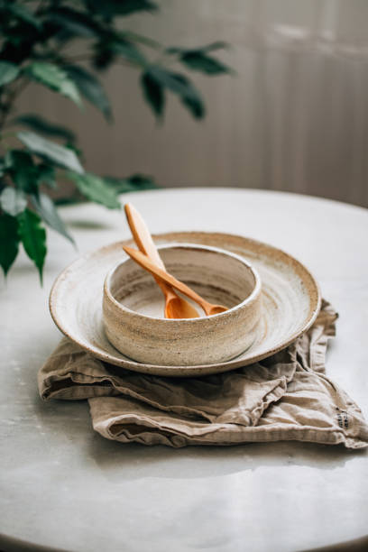 istock hand made Stack of Plates, Bowls and cup in rustic style 1162156321