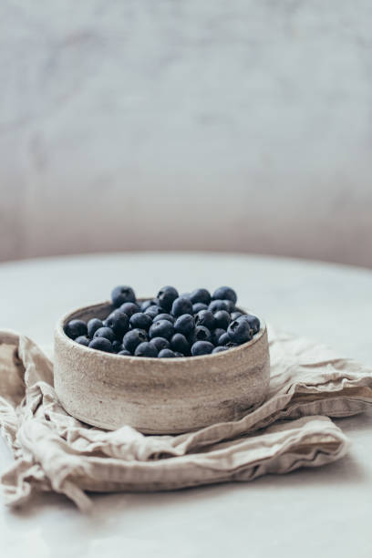 istock Blueberry bowl on white background with copy space in rustic style 1162156394