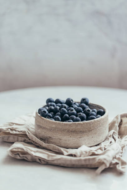 istock Blueberry bowl on white background with copy space in rustic style 1162156398