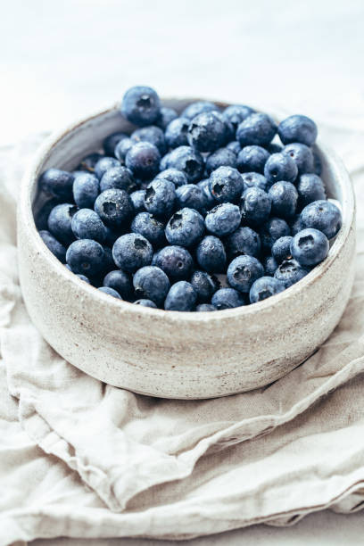 istock Blueberry bowl on white background with copy space in rustic style 1162156424