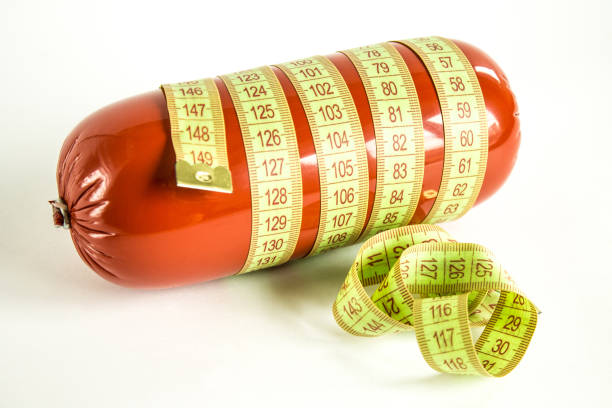 istock Sausage wrapped in measuring tape 1162157645