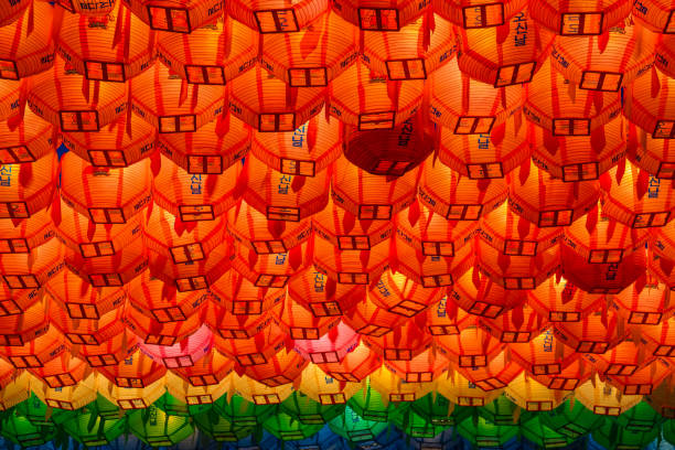 Rows and rows of colorful illuminated buddhist lotus lanterns hanging overhead at the . Jogyesa Buddhist temple in Seoul, South Korea.