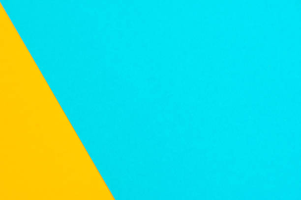 istock Yellow blue paper colored paper background 1162160824