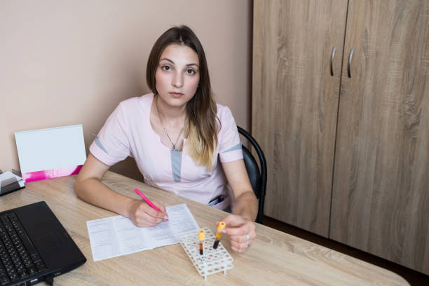 istock The junior nurse works at the desk. 1162162345