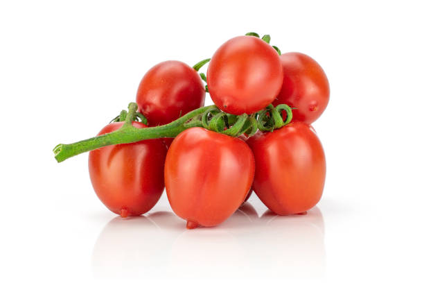 Red cherry tomato isolated on white stock photo