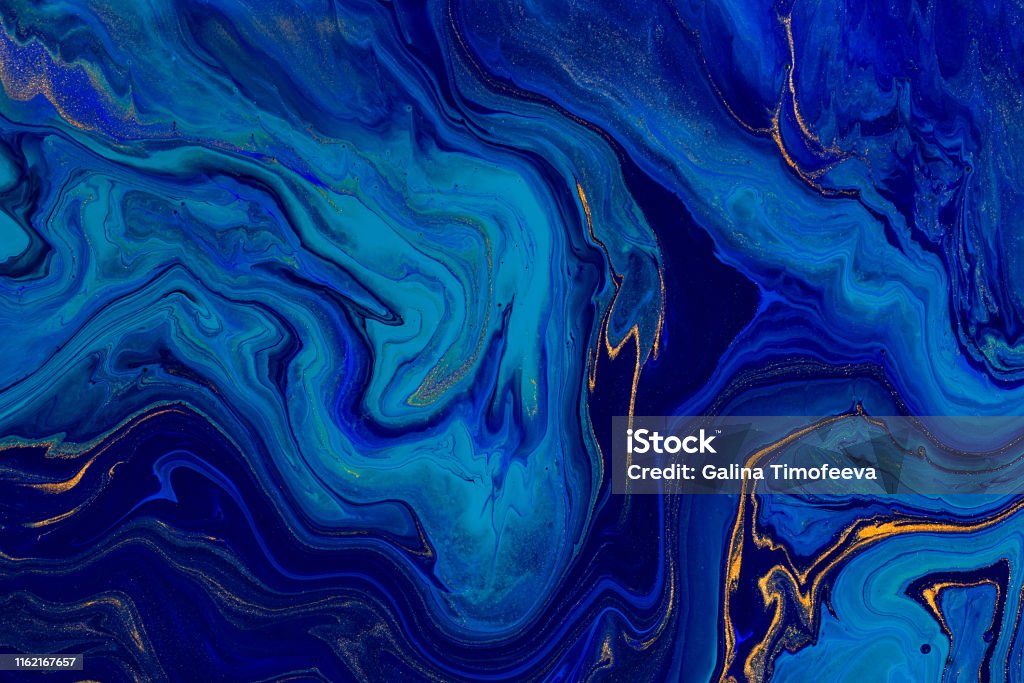 Hand painted background with mixed liquid blue and golden paints. Abstract fluid acrylic painting. Modern art. Marbled blue abstract background. Liquid marble pattern - Royalty-free Azul Foto de stock