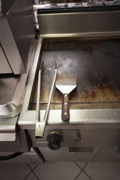 istock Barbecue Utensils on Grill Plate 1162168510