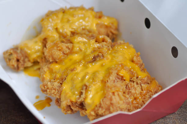 istock fried chicken, deep fried chicken with cheese topping 1162170034