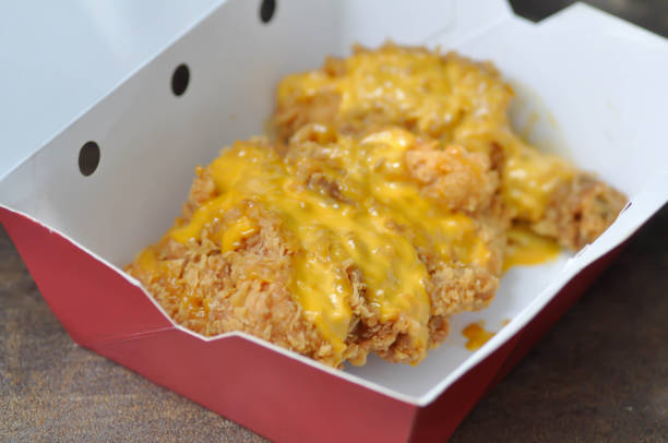 istock fried chicken, deep fried chicken with cheese topping 1162170091