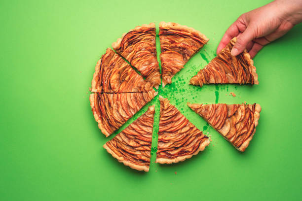 istock Taking a slice of apple pie. Eating autumn dessert 1162173176