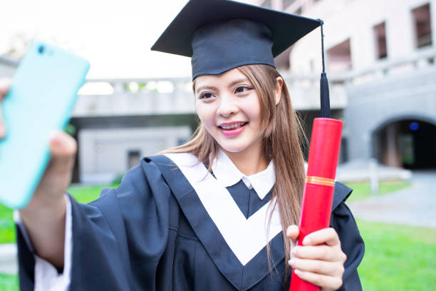 istock Girl gratuate take selfie happily 1162173826