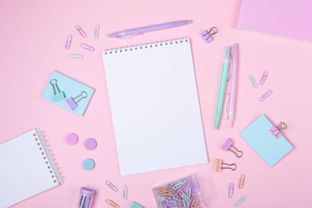 istock School background with notebooks and pastel colorful study accessories on pink background Back to school concept 1162177053