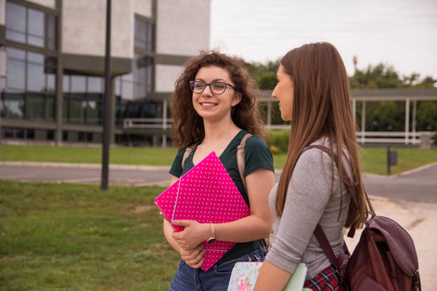istock Female college students on university campus 1162177196