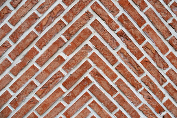 istock Abstract background of a  red brick wall with zigzag pattern 1162179229