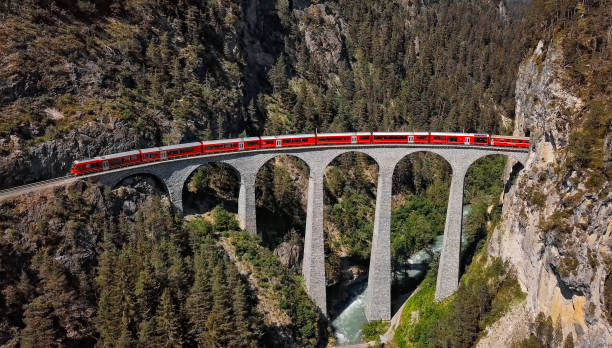 Aerial view of train on famous Landwasser Viaduct (Landwasserviadukt), Graubunden, Switzerland. Aerial panorama of train on Landwasser Viaduct, Switzerland graubunden canton photos stock pictures, royalty-free photos & images