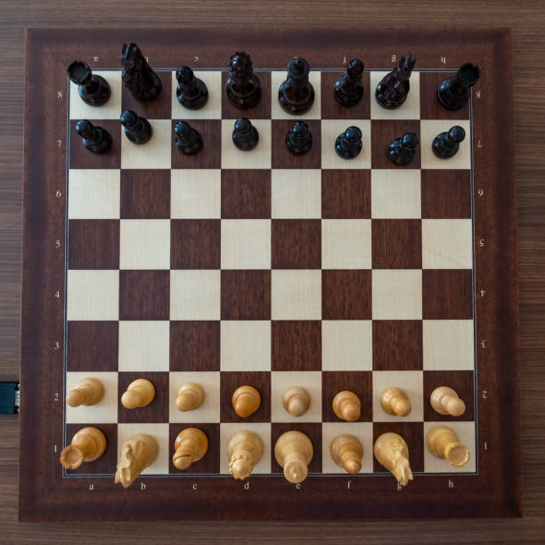 istock Top view on chess pieces on the board Before the chess tournament. 1162183296