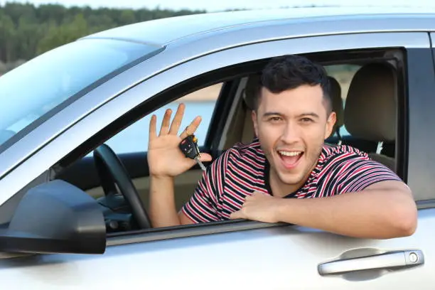 Photo of Cute ethnic driver holding car keys