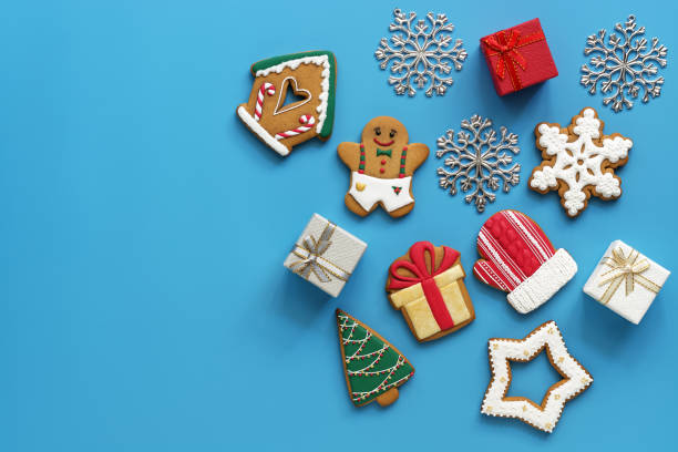 istock Christmas background, gingerbread and gift boxes on a blue background.View from above, flat lay, copy space. 1162183567