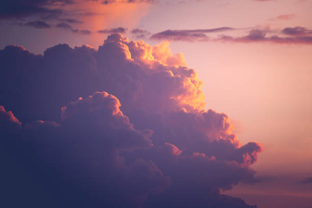 istock colorful rainy cloud on sunset time and sun light 1162185782