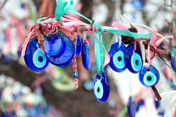 istock Evil eye charms hang from a tree in Cappadocia, Anatolia, Turkey 1162188043