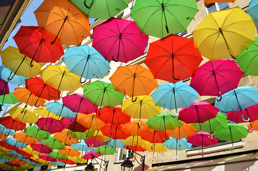 colorful umbrellas in village royale paris, france
