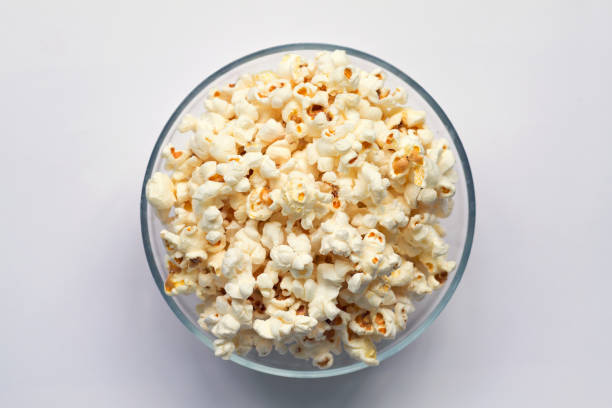 istock bowl of popcorn isolated on white background top view 1162188630
