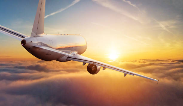 istock Passengers commercial airplane flying above clouds 1162189861