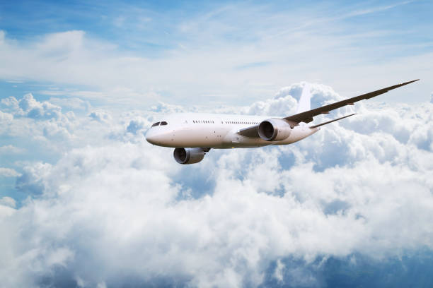 istock Passengers commercial airplane flying above clouds 1162189871