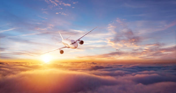 istock Passengers commercial airplane flying above clouds 1162189922