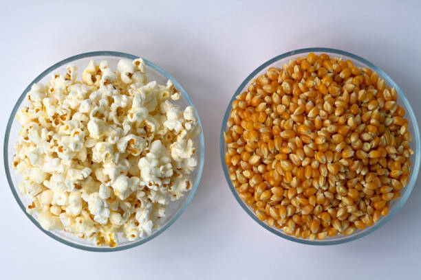 istock White popcorn and yellow corn in the bowls isolated on white background. 1162190037