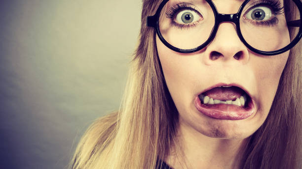 istock Closeup woman shocked face with eyeglasses 1162190489