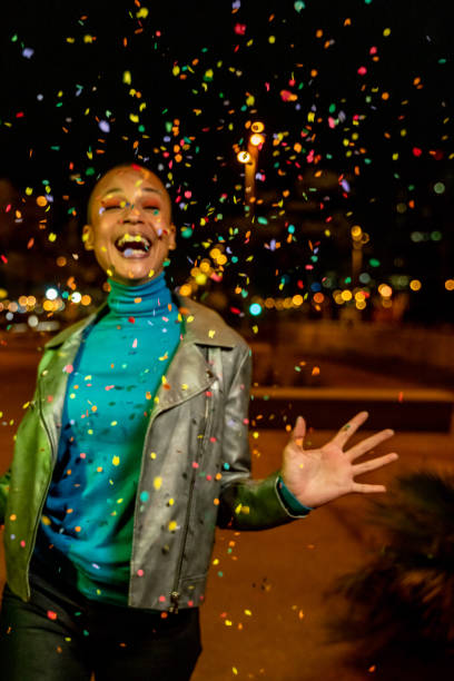 istock Cool woman under a rain of confetti 1162190645