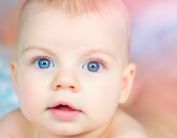 istock Cute Baby Looking at Camera 1162191799