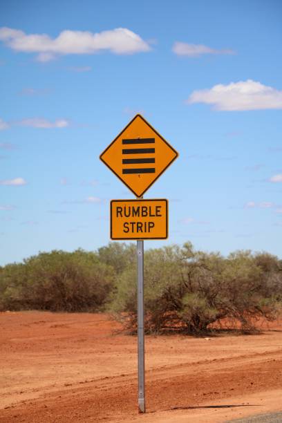 segnale stradale della striscia di rombo in australia - rumble strip foto e immagini stock