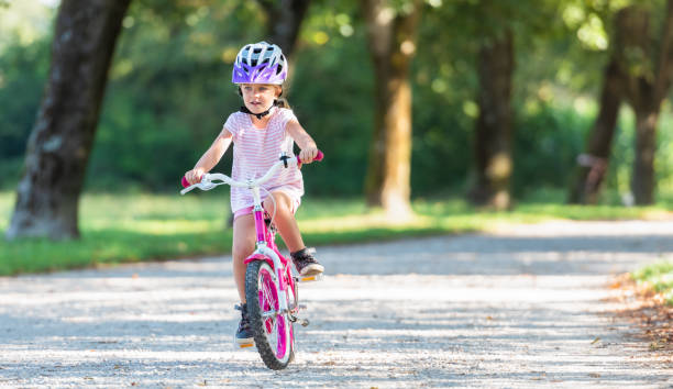 istock Girl Riding Bicycle 1162193238
