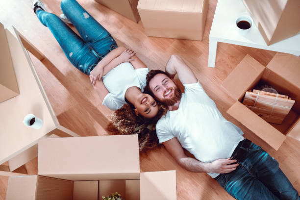 istock Couple Half Packed Relaxing And Enjoying Coffee 1162195242