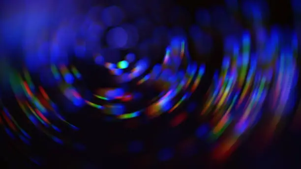Photo of Colorful Neon Spiral Nebula Galaxy Swirl Pattern Rotor Abstract Blur Motion Speed Bokeh Black Background