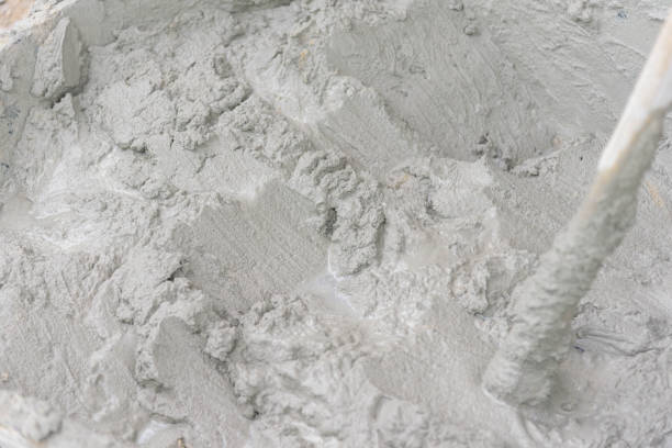 istock mixing the cement on tray for plaster the building 1162198492
