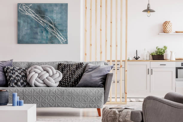 istock Abstract blue painting on empty white wall of open plan apartment 1162198518