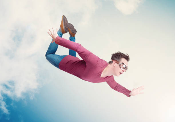 istock Crazy man in goggles is flying in the cloudy sky. Jumper concept 1162199959